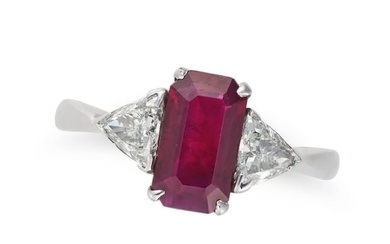 A BURMESE RUBY AND DIAMOND THREE STONE RING in 18ct white gold, set with an octagonal step cut ruby