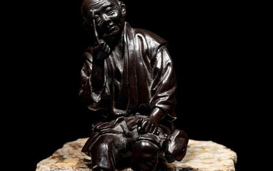 A Bronze Okimono of an Elderly Man