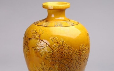 A CHINESE YELLOW GLAZED RELIEF DECORATED VASE