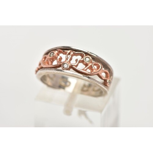 A CLOGAU SILVER AND GOLD RING, designed with a rose gold ope...