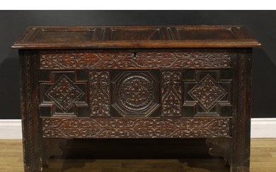 A Charles II oak three panel blanket chest, hinged top, the ...