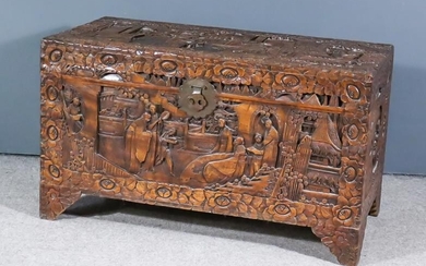 A Chinese Carved Camphorwood Chest, the whole carved with...
