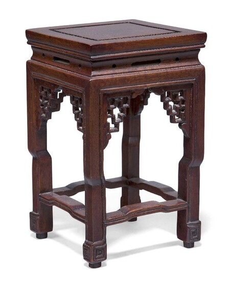 A Chinese hardwood square vase stand, 20th century, with pierced geometric spandrels and square stretchered legs, 16.5cm high