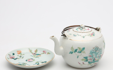 A Chinese porcelain teapot and saucer.