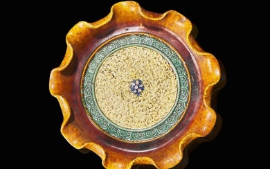 A Chinese sancai-glazed tripod dish with wood stand, possibly Ming dynasty 三彩三
