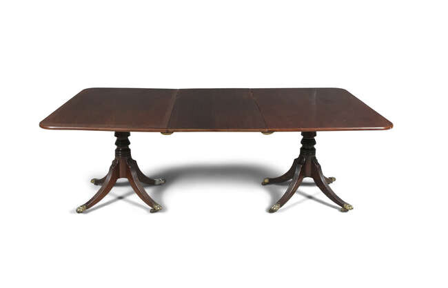 A GEORGIAN STYLE MAHOGANY RECTANGULAR DINING TABLE, with...