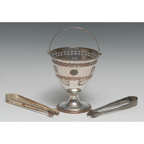 A George III Old Sheffield Plate swing-handled urnular pedes...