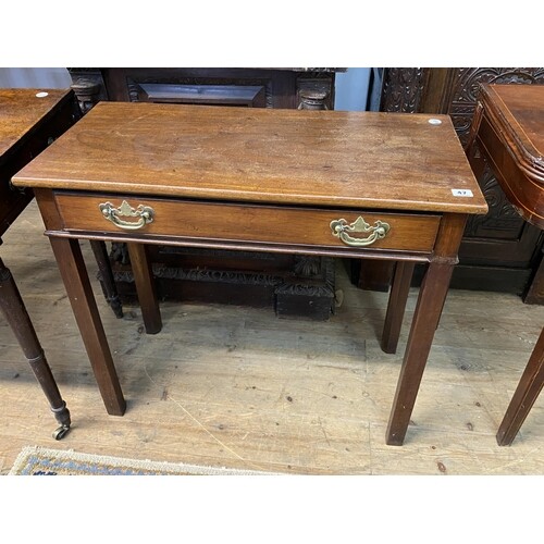 A Georgian mahogany side table with a single drawer, brass d...