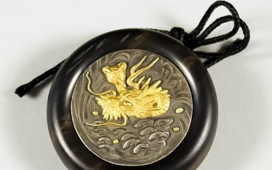 A Japanese Kagmibuta Netsuke, Meiji Period, the ebony bowl...