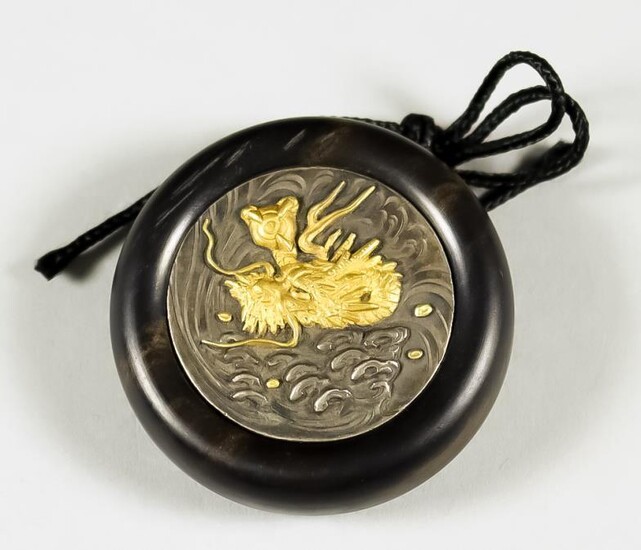 A Japanese Kagmibuta Netsuke, Meiji Period, the ebony bowl...