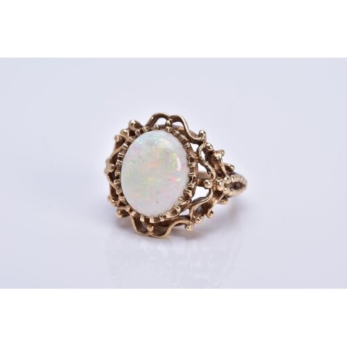 A LATE 20TH CENTURY 9CT GOLD OPAL SINGLE STONE RING, opal me...