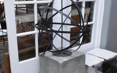 A METAL ARMILLARY ON CONCRETE PLINTH (PLEASE NOTE THIS ITEM MUST BE REMOVED BY CLIENTS OR CARRIERS AT THE CUSTOMERS EXPENSE.)