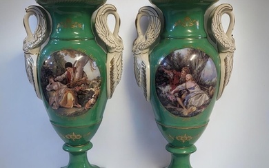 A PAIR OF FRENCH SEVRES STYLE GREEN PORCELAIN URNS In classi...