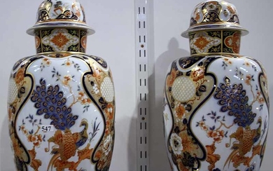 A PAIR OF GERMAN PORCELAIN COVERED VASES