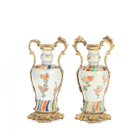 A PAIR OF UNUSUAL UNDERGLAZE BLUE AND ENAMELLED VASES WITH GILT BRONZE ROCOCO-STYLE MOUNTS