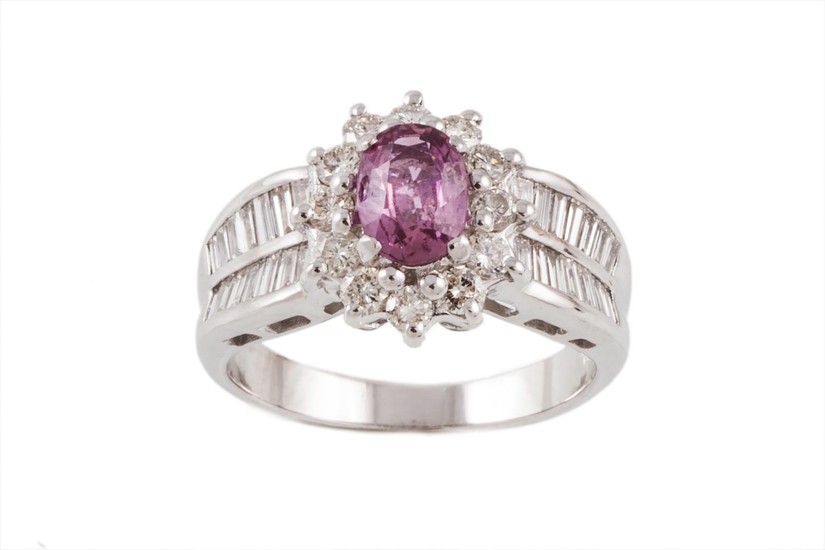 A PINK SAPPHIRE AND DIAMOND OVAL CLUSTER RING, one oval cut ...