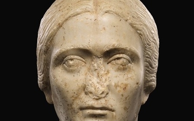 A ROMAN MARBLE PORTRAIT HEAD OF A WOMAN, ANTONINE, 3RD QUARTER OF THE 2ND CENTURY A.D.