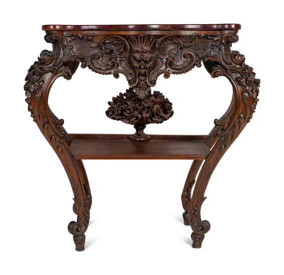 A Renaissance Revival Carved Walnut Serpentine Top Console Table