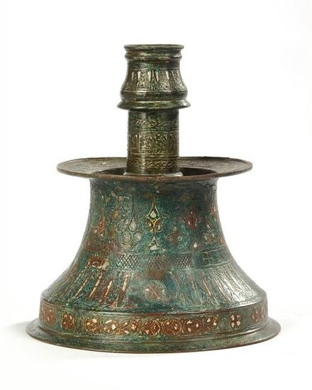 A SILVER-INLAID CANDLESTICK, PERSIA, 11TH-12TH CENTURY