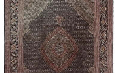 A Tabriz Mahi carpet, Persia. Medallion design. Outlines with silk pile. Good...