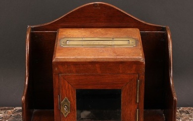 A Victorian oak country house post box, central brass apertu...