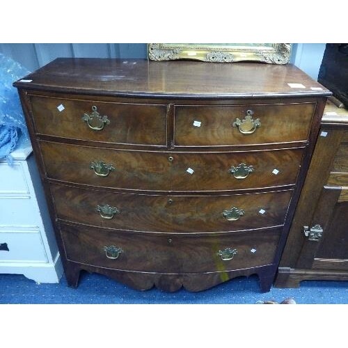 A Victorian walnut bow front Chest of Drawers, two short dra...