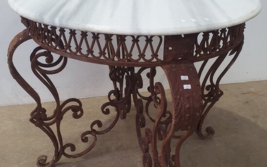 A WROUGHT IRON BASED MARBLE TOP CENTRE TABLE