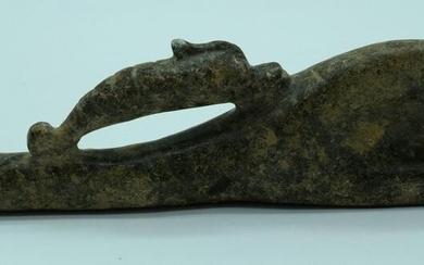 A carved stone grinding tool in the shape of a bird