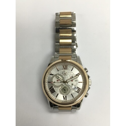 A gents Guess stainless steel watch.