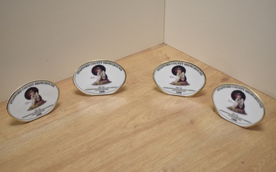 A group of four Royal Doulton bone china 'The 14th International Royal Doulton & Beswick