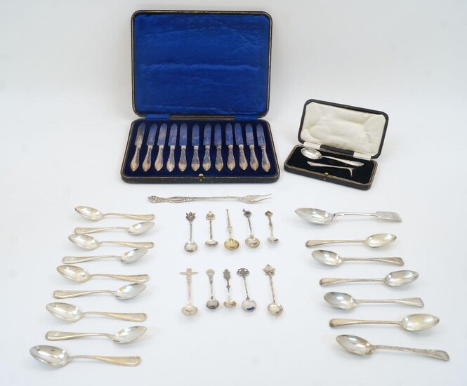 A group of silver and white metal, to include: a cased set of 12 silver handled dessert knives, Sheffield, 1914, William Hutton & Sons Ltd; five Victorian silver teaspoons, London, 1872, Chawner & Co; nine similar teaspoons, stamped Sterling, by...