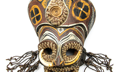 A handpainted PNG Sepik river cultural mask with boar tusk...