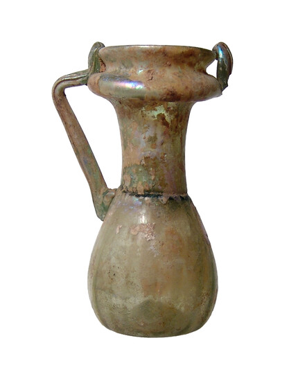 A late Roman pale green glass bottle