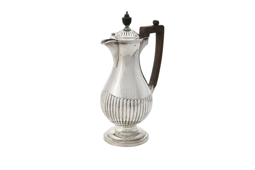 A late Victorian silver lobed baluster water jug by Goldsmiths & Silversmiths Co.