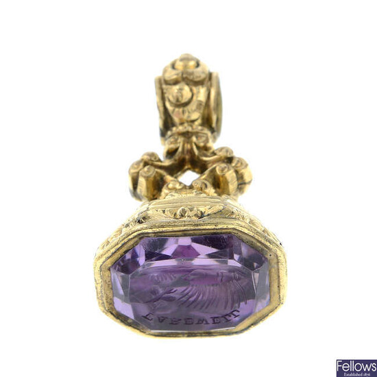 A mid 19th century amethyst intaglio fob seal, depicting a butterfly emerging from chrysalis, beneath the word 'Farewell'.