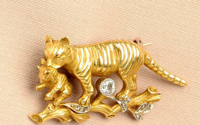 A mid 20th century 18ct gold tiger and kitten brooch, with old-cut diamond highlight, on a rose-cut diamond accent branch.