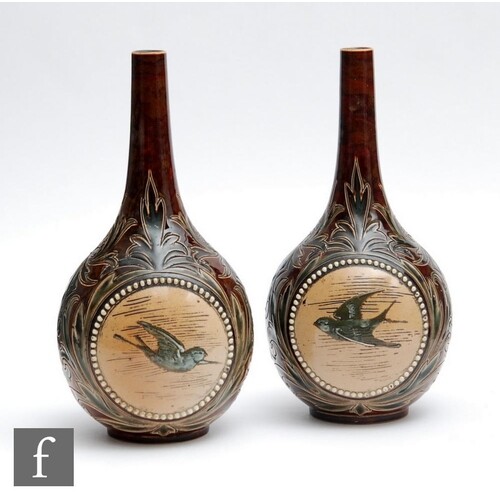 A mirrored pair of late 19th Century Doulton Lambeth bottle ...