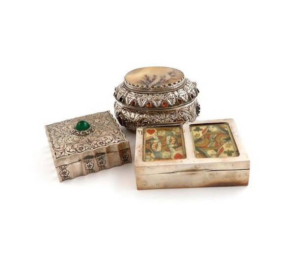 A mixed lot of silver boxes, comprising: one with an Austrian import mark, oval form, the hinged cover set with a hardstone panel, embossed decoration, and applied with coloured cabochons, length 10.5cm, an Edwardian playing cards box, by H V Pithey &...