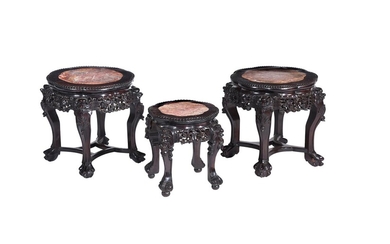 A pair of Chinese of carved hardwood and marble inset low tables or stands