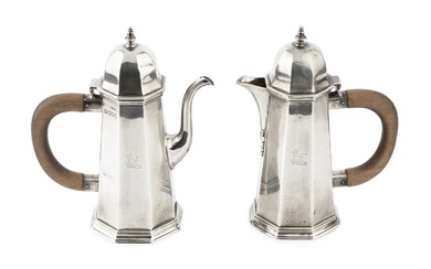 A pair of Edwardian silver cafe au lait pots, of...