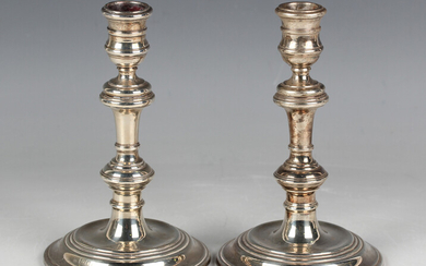 A pair of Elizabeth II silver knop stem candlesticks, each with a reeded circular base, London 1964
