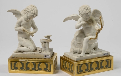 "A pair of Empire biscuit porcelain putti resting on green and gold patina bases decorated with acanthus leaves. Mark in red of the factory of Dihl & Crochard in Paris. Period: early 19th century. (**). H.:+/-30cm.