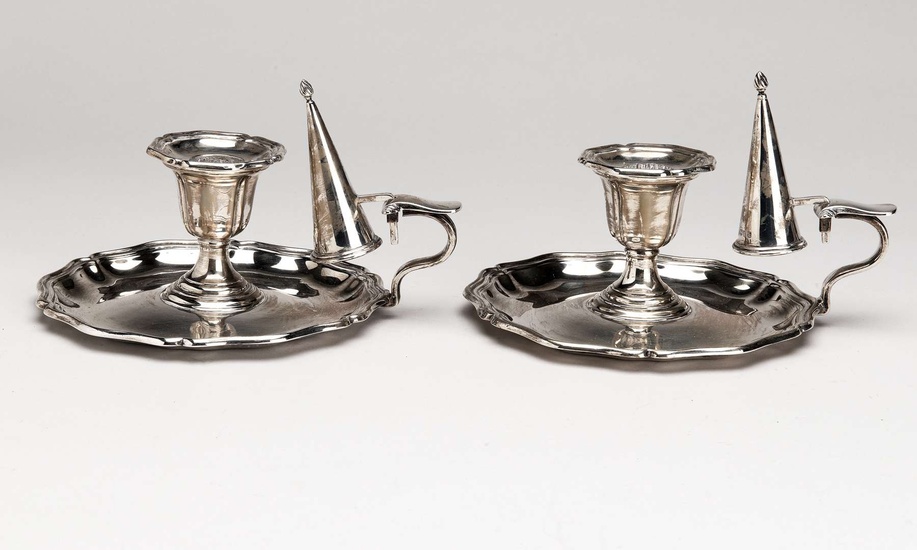 A pair of English silver chamber candlesticks with snuffers