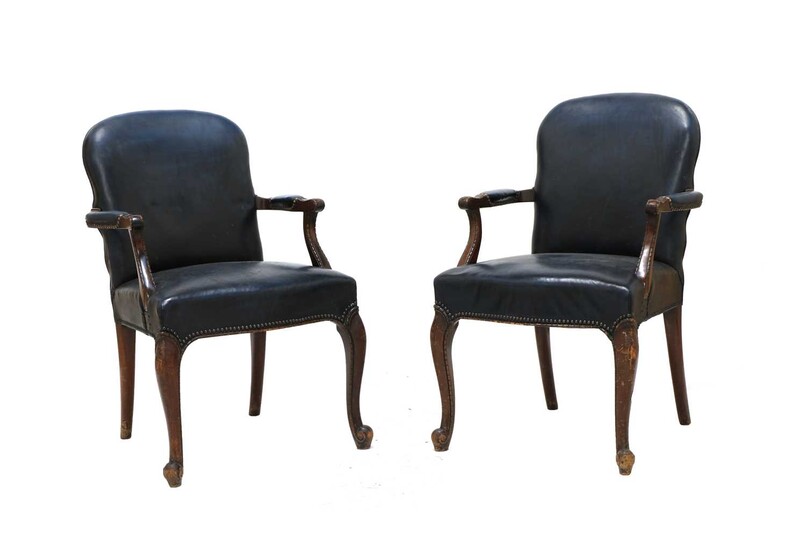 A pair of Georgian style carved mahogany open armchairs
