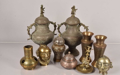 A pair of Middle Eastern metal lidded urns