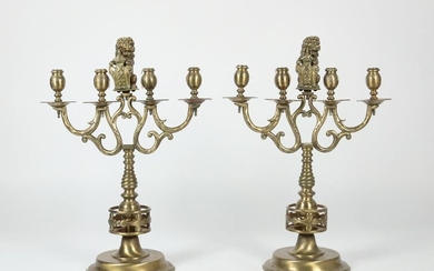 A pair of Renaissance Revival brass candelabra