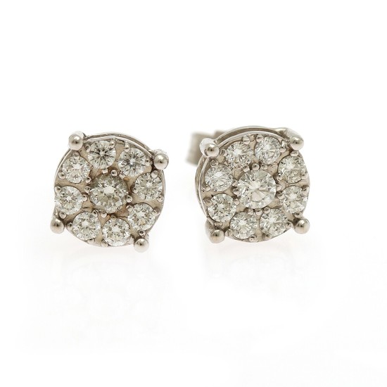 A pair of diamond ear studs each set with nine brilliant-cut diamonds totalling app. 0.64 ct., mounted in 18k white gold. Diam. app. 8 mm. (2)