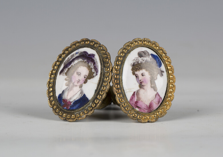 A pair of late 18th century enamel and gilt metal curtain tie backs, each decorated with a portrait