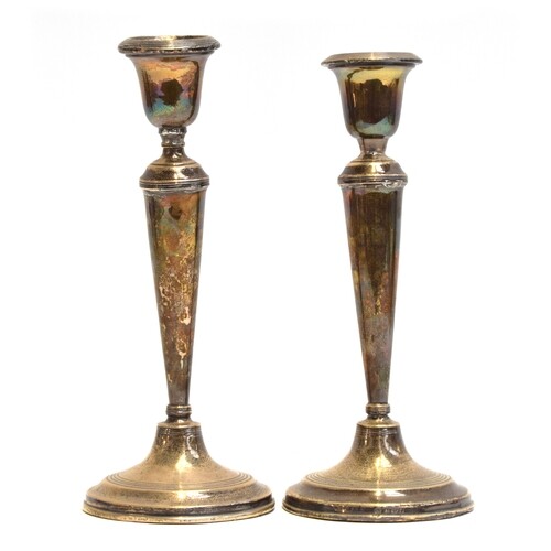 A pair of silver candlesticks by William Hutton & Sons Ltd, ...