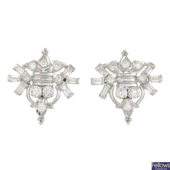 A pair of vari-cut diamond geometric earrings.